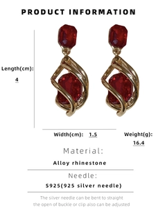 Detailed view of red crystal teardrop earrings with dimensions 4cm length and 1.5cm width
