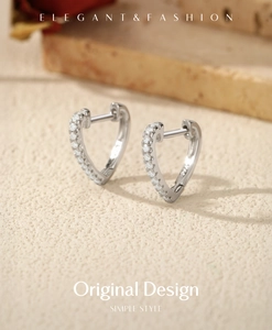 Macro shot of silver S925 heart hoop earrings with VVS1 moissanite pave setting