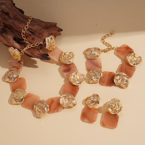 Vintage resin jewelry set featuring irregular marble patterns and gold metal sweater chain