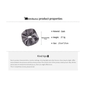 Detail showing grey satin fabric scrunchie size of 17cm and weight of 27.3g