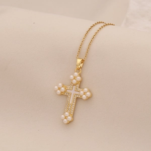 Elegant gold stainless steel cross necklace featuring faux pearls and sparkling crystals