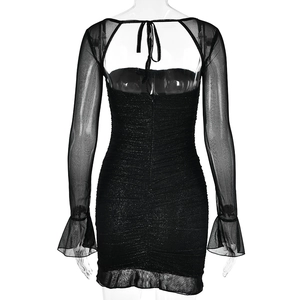 Detail of sexy backless black bodycon dress with sheer mesh sleeves and ruffled hem