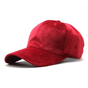 Detailed side view of a solid red velvet baseball cap showing soft texture and sheen