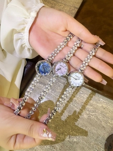 Three elegant quartz bracelet watches with mother-of-pearl dials and pearl metal straps