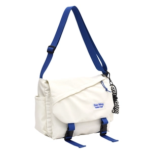 Japanese style cream white crossbody messenger bag with blue straps and checkered charm