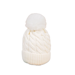 Detailed view of white cable knit beanie featuring a large faux fur pom-pom on top
