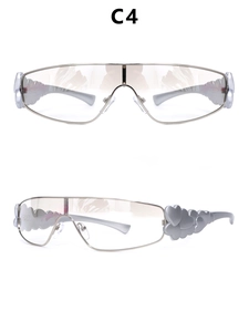 Detail view of silver Y2K shield sunglasses featuring triple heart relief on temples