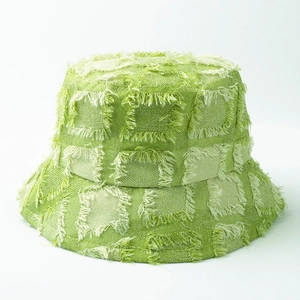 Green plaid bucket hat with frayed edges for women featuring a retro checkerboard pattern