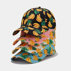Detail view showing four colors of baseball caps with tropical banana leaf patterns