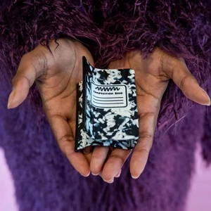 Detailed view of square hair claw clip featuring black and white composition book pattern