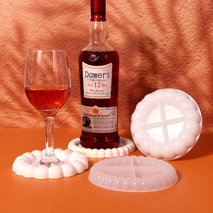Macro detail of bubble-edged silicone coaster mold and finished resin drink tray