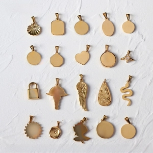 Detailed back view of gold-plated 18K titanium steel charms with polished textures