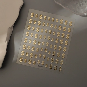 Golden 3D dollar sign nail stickers with metallic embossed texture on transparent sheet