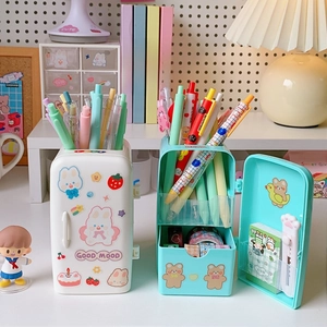 Detail of refrigerator-shaped desk organizer with cute stickers and storage drawers