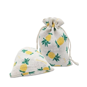 Detail of pineapple printed cotton linen drawstring pouch showing fabric texture and design