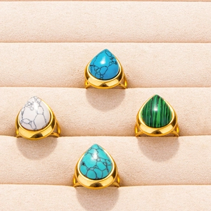 Set of 4 gold teardrop rings with turquoise stones in white, blue, and green colors