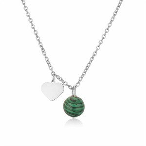 Detail of silver heart pendant and green malachite bead on stainless steel chain