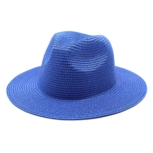 Classic bright blue woven straw Panama hat with wide brim for summer sun protection
