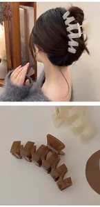 Close-up of 13cm oversized acrylic hair claws in beige and dark coffee colors