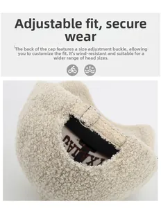 Detail of adjustable metal buckle on beige teddy fleece baseball cap for head size adjustment
