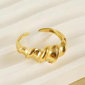 Adjustable twisted gold ring with irregular texture and polished finish for women