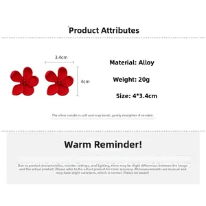 Detail view showing red matte flower petal earrings with size and weight specifications