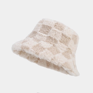 Close-up of plush checkered bucket hat with soft beige and khaki fuzzy texture details