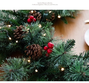 Detail of 135cm lighted Christmas garland with pine needles, cones and red berries