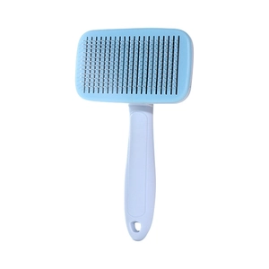 Brosse de toilettage bleue et blanche à long manche pour chiens et chats
