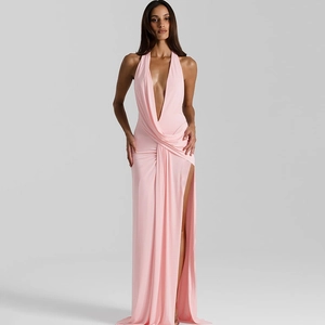 Detail of pink halter dress featuring deep V-neckline and smooth satin fabric texture