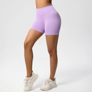 Detailed view of seamless high-waisted lavender yoga shorts with peach butt lift effect