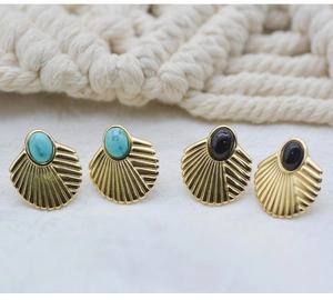 Detailed close-up of fan-shaped natural stone earrings with turquoise and black agate