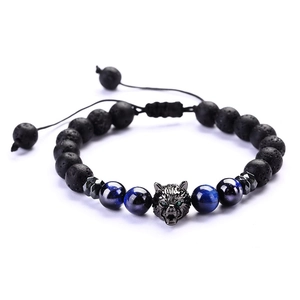 Detailed view of adjustable beaded bracelet with blue tiger eye and silver wolf head