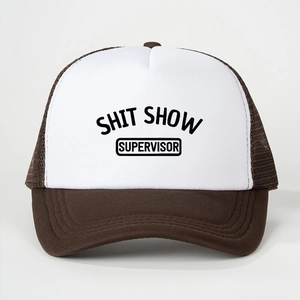 Detail of a brown and white mesh trucker hat featuring Shit Show Supervisor text