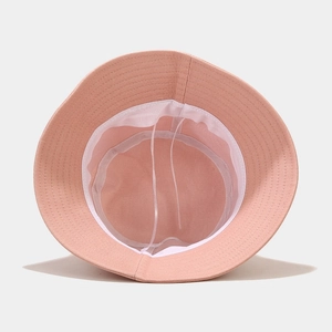 Pink fisherman hat interior view showing adjustable drawstring and white sweatband details
