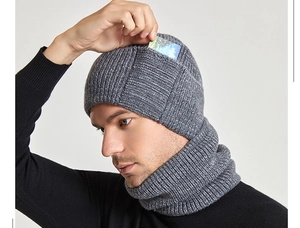 Detail of grey winter knit beanie featuring a functional small side pocket for cards