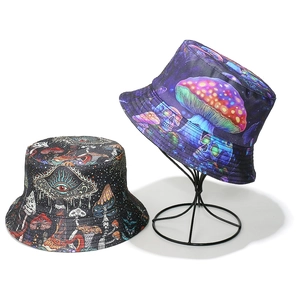 Psychedelic mushroom and mystic eye print bucket hats in black and purple colors