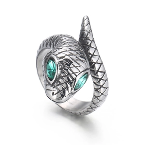 Silver stainless steel snake ring with green eyes and detailed scales on white background