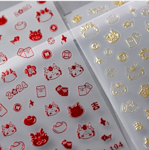 Macro detail of 3D embossed dragon nail art stickers with gold foil festive designs