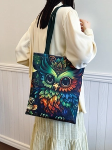 Spacious canvas tote bag featuring a vibrant owl print design on a white background