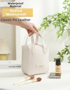 Detail of white PU leather cosmetic bag with dual zippers and water-resistant finish