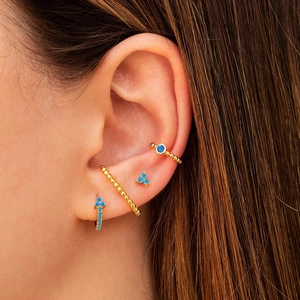 Bohemian gold plated earring set featuring blue gemstone studs and ear cuffs for women