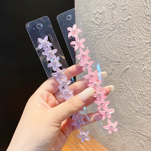 Mini flower hair clips for girls in purple and pink resin with crystal accents