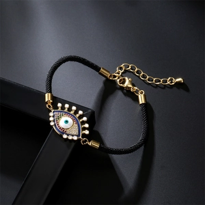 Bracelet œil porte-bonheur tressé réglable avec métal doré et pierres en zircon colorées