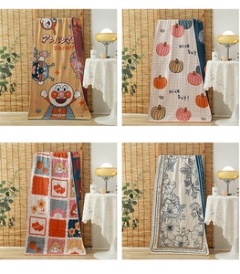 Detail of four-layer cotton gauze bath towel with diverse cartoon patterns and soft texture
