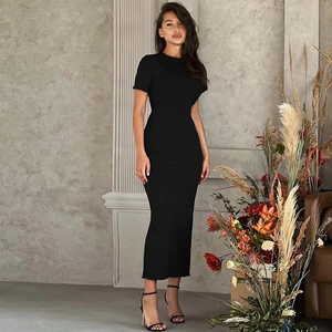 Detailed view of the slim fit knitted dress featuring vertical ribbed fabric texture