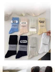Detail of soft cotton crew socks with bow design showing eight vibrant candy colors