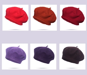 Detail showcasing six classic wool beret colors including red, purple, and brown tones