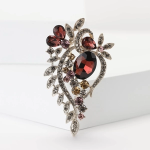 Vintage alloy brooch with large oval pigeon blood red stone and sparkling crystals
