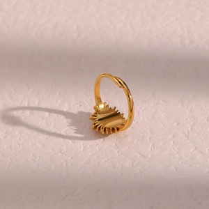 Detail of 18K gold plated stainless steel sunburst ring with open adjustable band